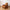 Brown power recliner chair with massage features.